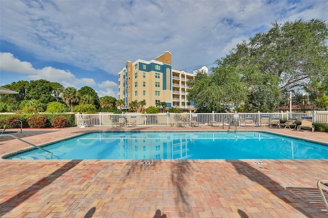 view of swimming pool with a patio area