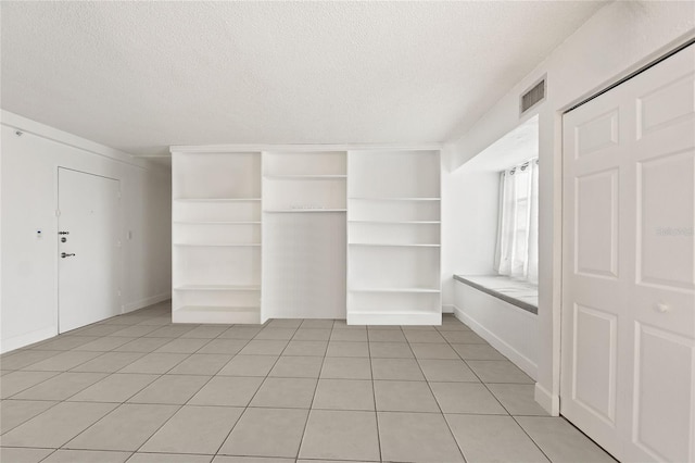 walk in closet featuring light tile patterned floors