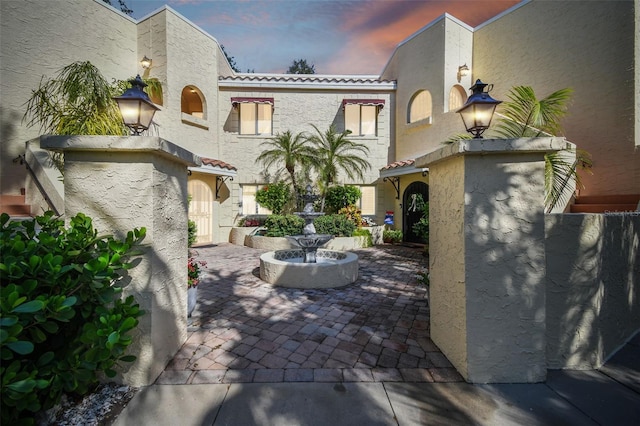 view of patio terrace at dusk