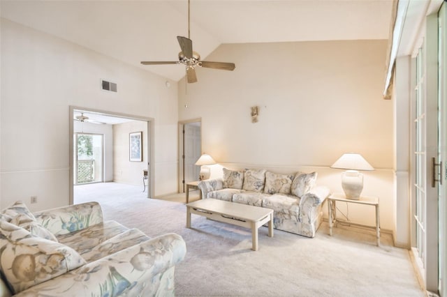 living room with light carpet, high vaulted ceiling, and ceiling fan