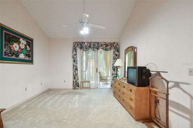 interior space featuring ceiling fan, lofted ceiling, and light carpet