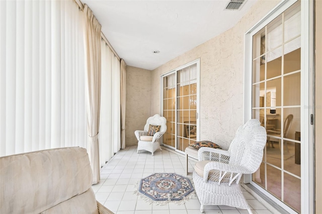 sitting room with light tile patterned floors