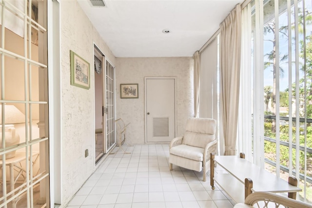 sitting room featuring light tile patterned floors