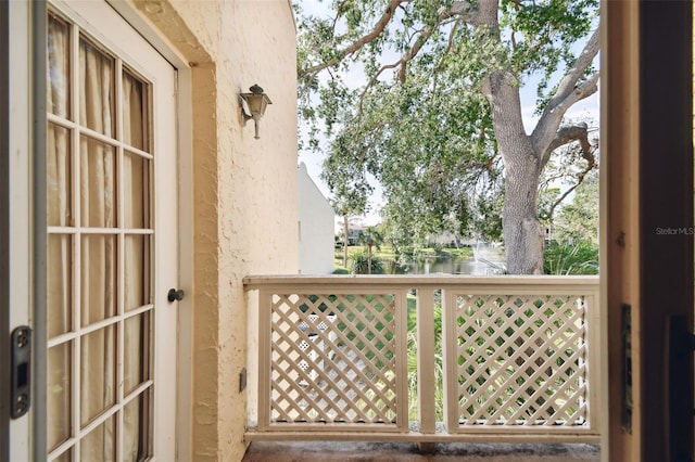 balcony featuring a water view