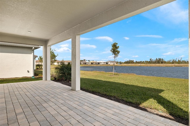 view of patio featuring a water view