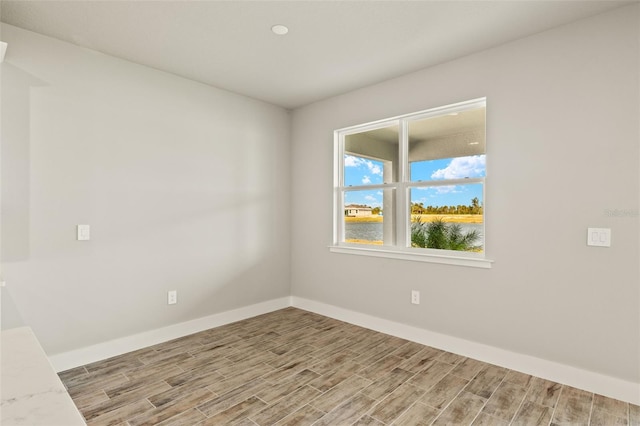 unfurnished room featuring light wood-type flooring