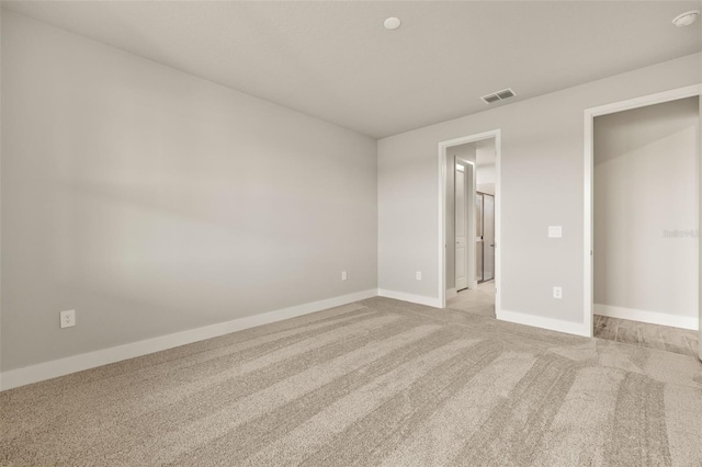 unfurnished bedroom with light carpet