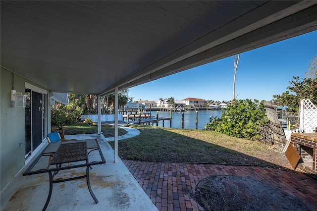 505 80th Ave, St Pete Beach, FL 33706 - view of patio featuring a water view, a dock, and boat lift