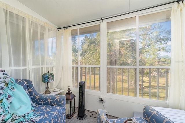 sunroom / solarium with a wealth of natural light and lofted ceiling