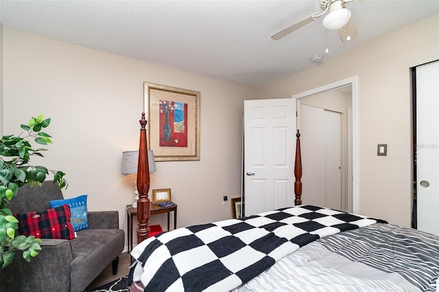 bedroom with a textured ceiling and ceiling fan