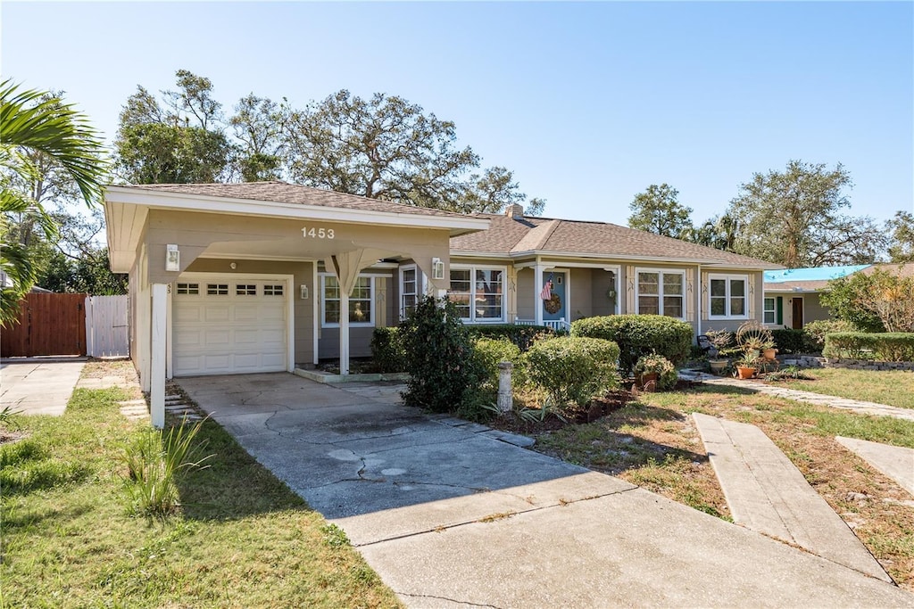 ranch-style house with a front lawn and a garage