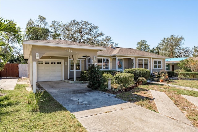 ranch-style house with a front lawn and a garage