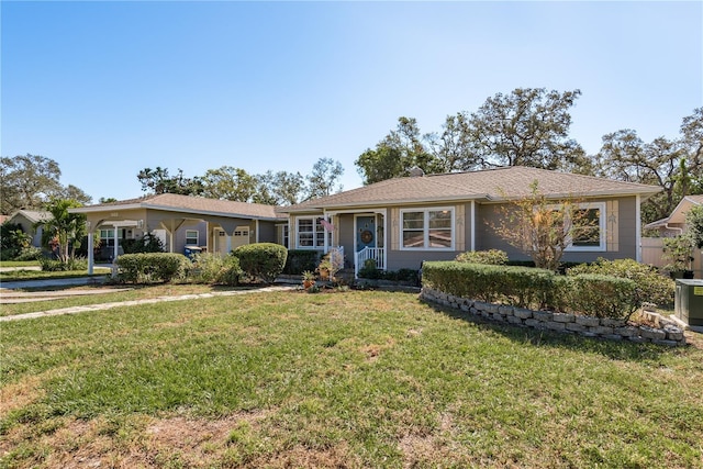 single story home featuring a front lawn