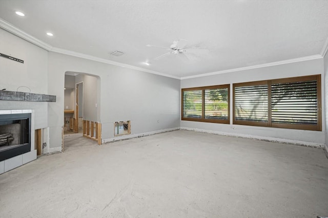 unfurnished living room with a fireplace, ceiling fan, and crown molding