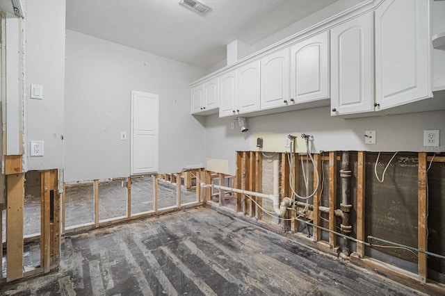 washroom with cabinets and dark wood-type flooring