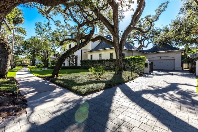 view of front of house featuring a front yard and a garage