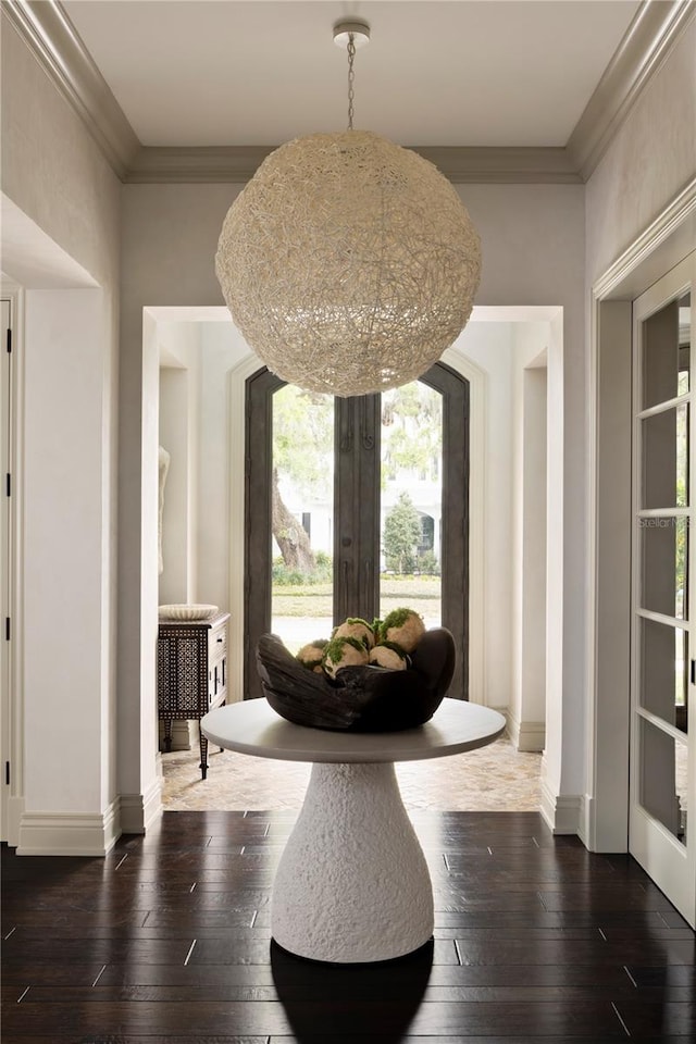 dining space with crown molding, french doors, and dark hardwood / wood-style floors