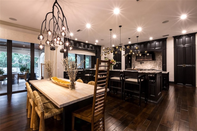 dining space with dark hardwood / wood-style flooring