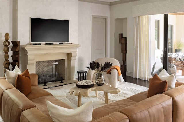 living room with crown molding and hardwood / wood-style floors