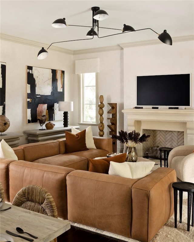 living room with wood-type flooring, an inviting chandelier, and crown molding