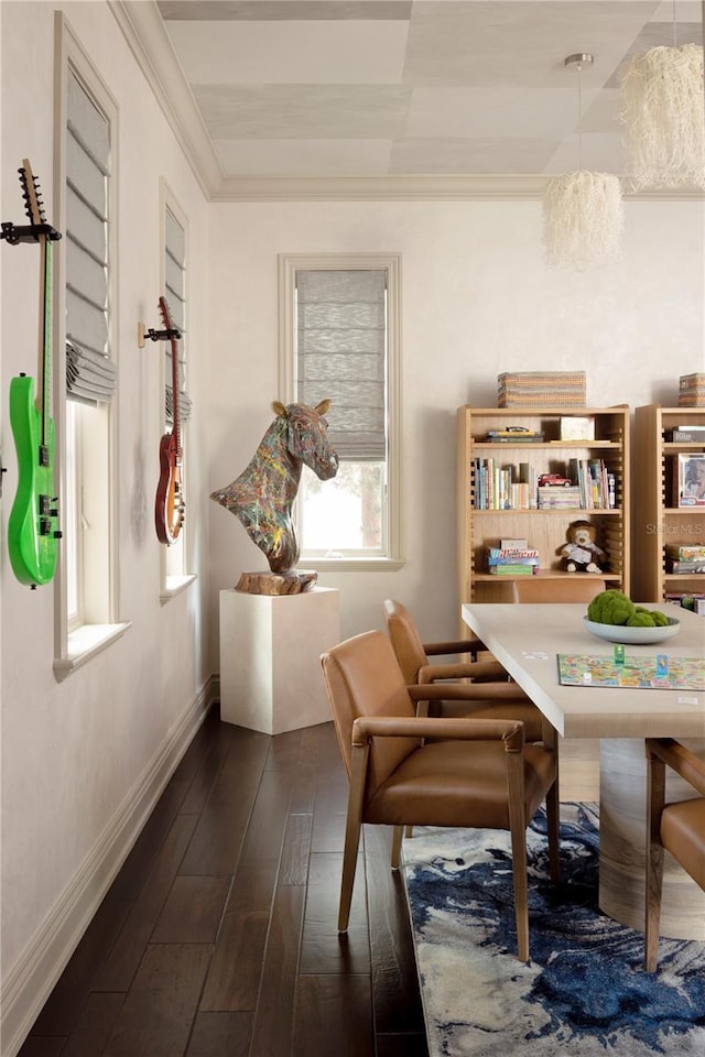 living area featuring crown molding, dark wood-type flooring, and a notable chandelier