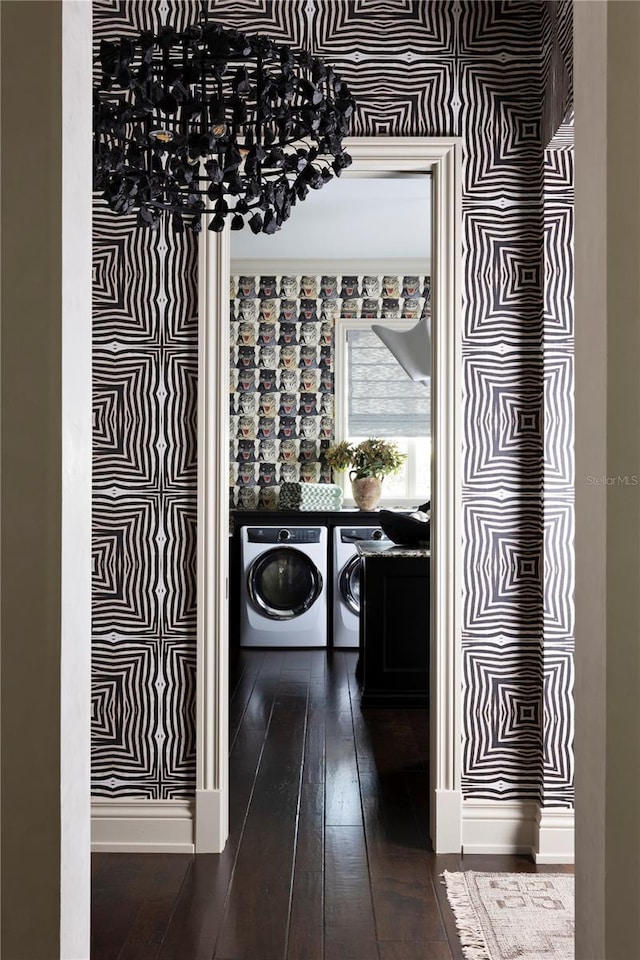 laundry room featuring dark hardwood / wood-style floors and separate washer and dryer