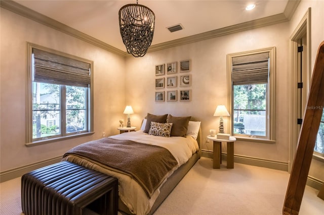 carpeted bedroom featuring multiple windows, ornamental molding, and a notable chandelier