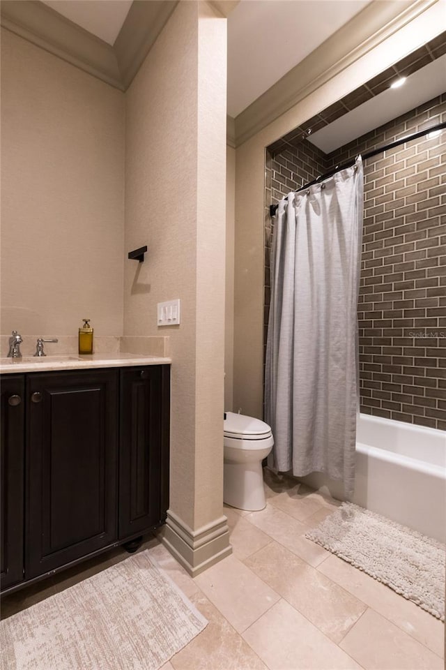 full bathroom featuring tile patterned flooring, vanity, shower / tub combo with curtain, and toilet