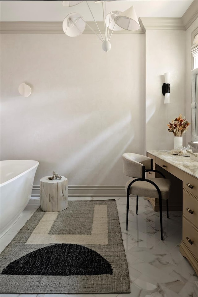 bathroom featuring vanity, crown molding, and a tub