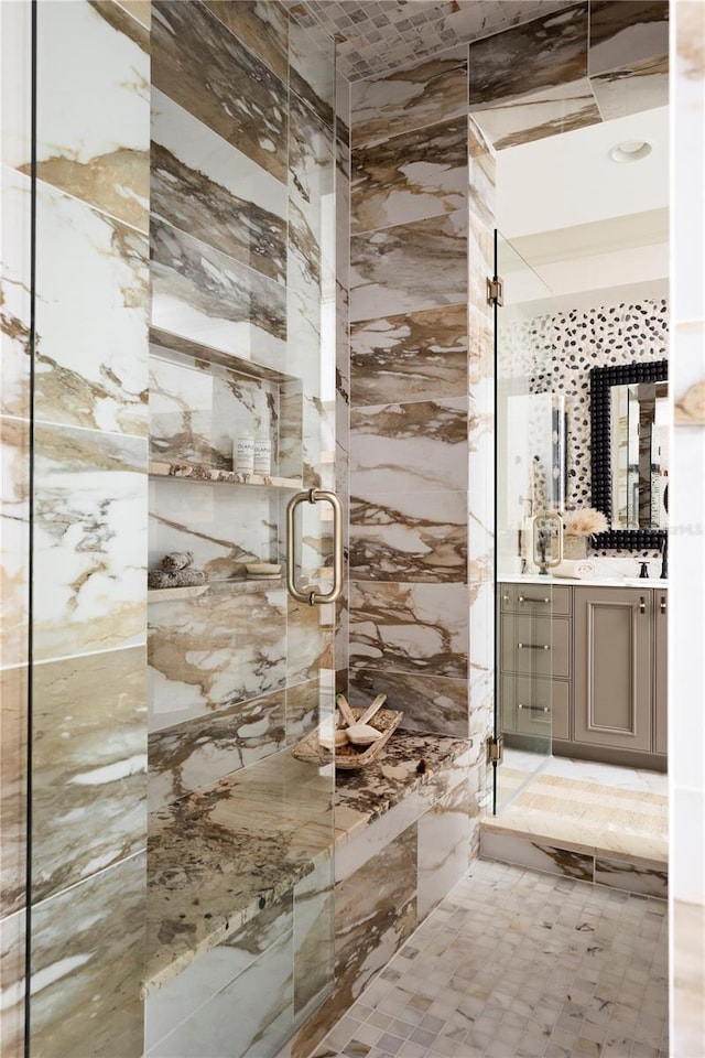 bathroom with vanity and a shower with shower door