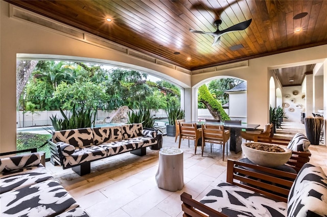 view of patio with outdoor lounge area and ceiling fan