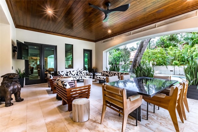 exterior space featuring outdoor lounge area, ceiling fan, and french doors