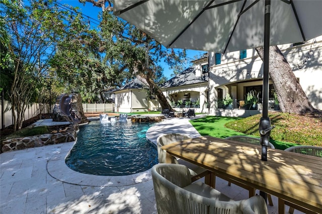 view of pool with a jacuzzi and a patio