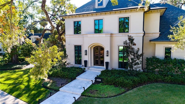 view of front of property featuring french doors and a front yard