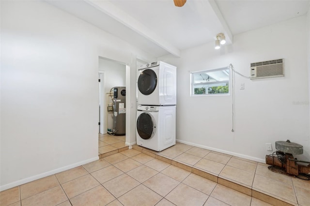 laundry room featuring a wall mounted AC, water heater, light tile patterned floors, and stacked washer / drying machine