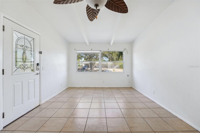 tiled foyer with beamed ceiling and ceiling fan