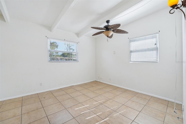 empty room with light tile patterned floors, vaulted ceiling with beams, and ceiling fan