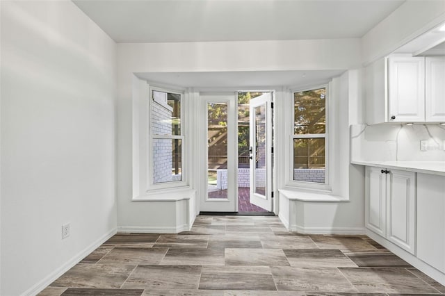 doorway with light hardwood / wood-style flooring