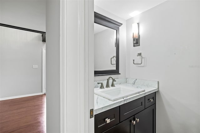 bathroom featuring vanity and wood-type flooring