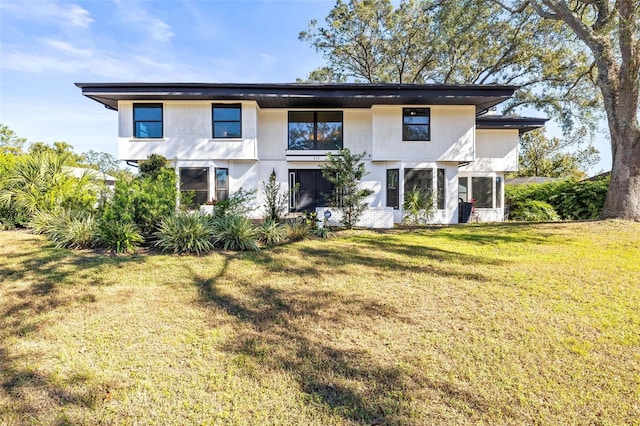 view of front of home with a front lawn