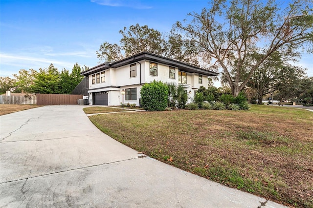 view of front facade featuring a front lawn and a garage