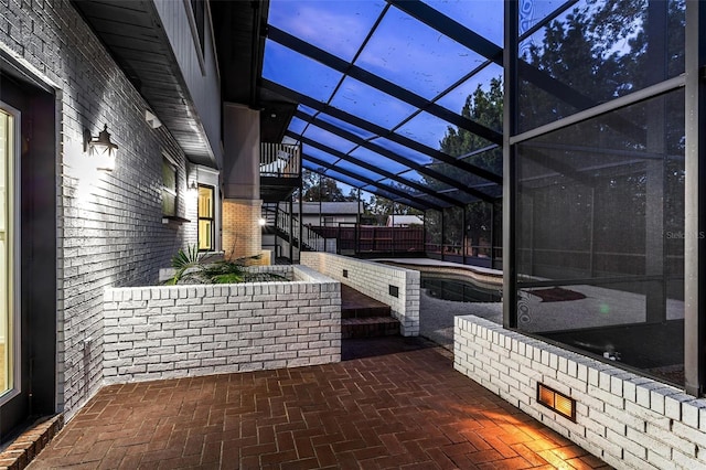 view of patio / terrace with a lanai