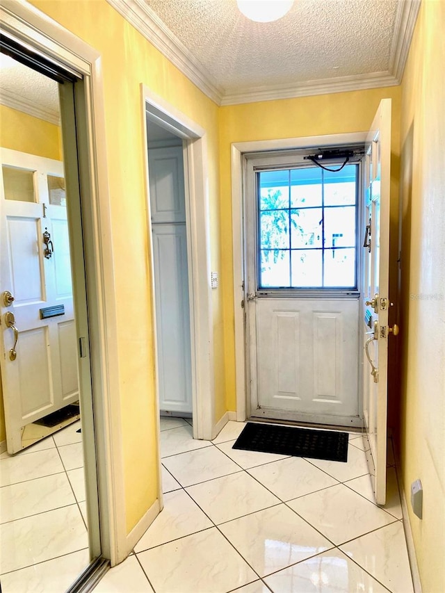 doorway to outside featuring light tile patterned floors, a textured ceiling, and ornamental molding