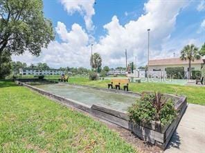 1660 S Lake Ave Unit 1, Clearwater, FL 33756 - view of property's community with a game area and a yard