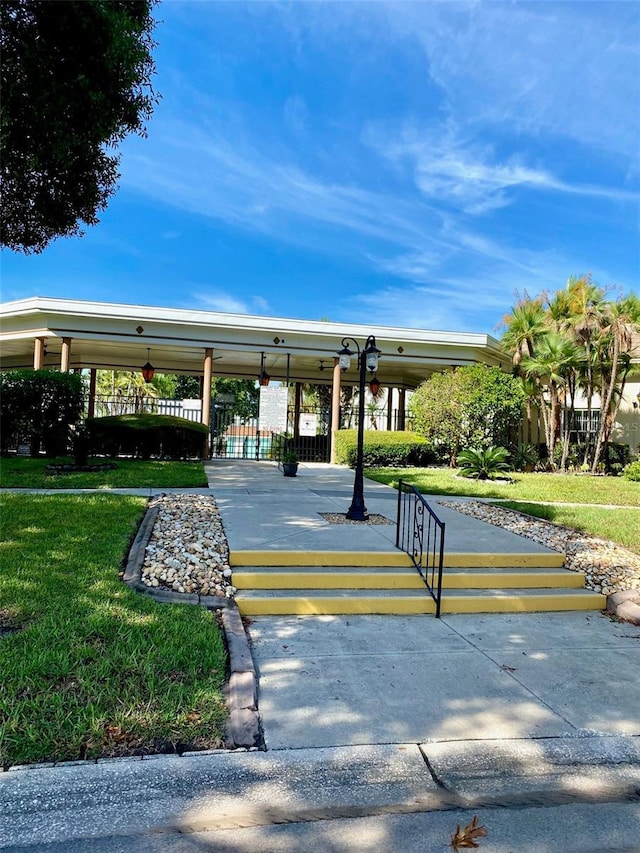 view of home's community featuring a lawn