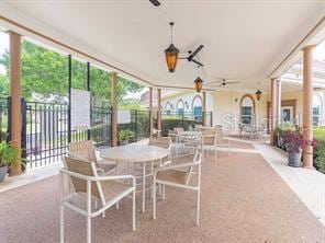 sunroom featuring ceiling fan