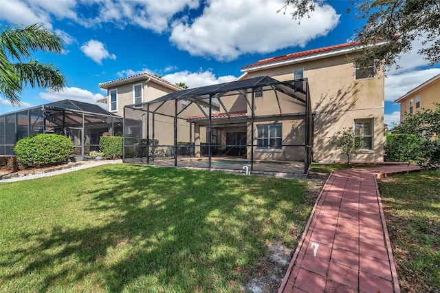 back of property featuring a yard, a pool, and a lanai