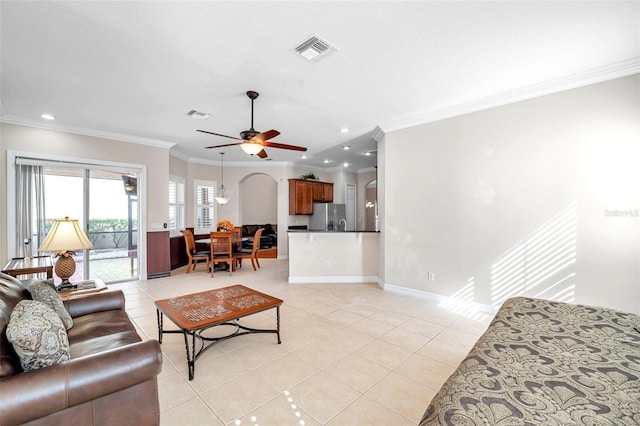 living room featuring ceiling fan, crown molding, and light tile patterned flooring