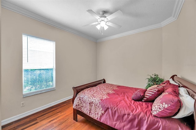 bedroom with wood-type flooring, ceiling fan, and crown molding