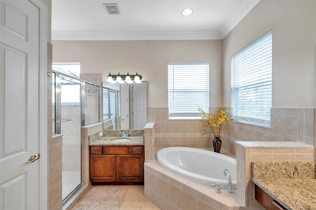 bathroom featuring tile patterned floors, vanity, ornamental molding, and independent shower and bath